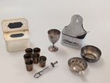 a lot of silver items that are on the table