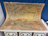 a map on top of a chest of drawers