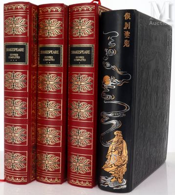 the three books are lined up in a row on a white surface