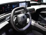the interior of a car with a steering wheel, dashboard, and display screen