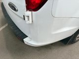 a close up of the rear end of a white truck