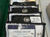 several bags of clothing are on a table in a store