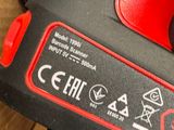 a red and black battery that is connected to a black and red charger