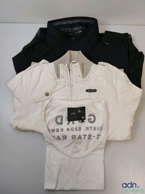 three t - shirts that are sitting on top of a white table