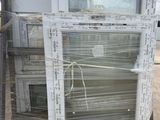 a pile of old windows sitting on top of a pallet