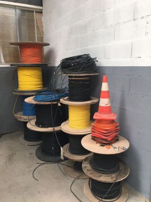 many spools of different colors and sizes of wires