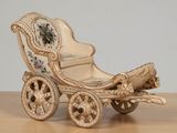 a miniature carriage that is sitting on a table