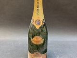 a close up of a bottle of champagne on a table