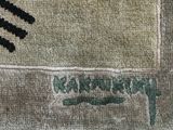 a close up of a rug with a design on it