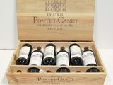 six bottles of wine in a wooden box