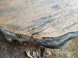 a wooden table that is sitting on the ground