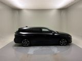 a picture of a black car in a white room