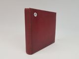 an image of a red book with a button on the cover