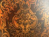 an old wooden box with a decorative design on it