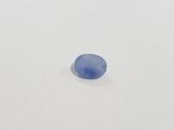 a blue stone on a white surface