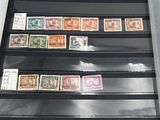 a close up of a collection of stamps on display in a case