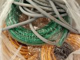 a bag full of wires and cords wrapped in plastic