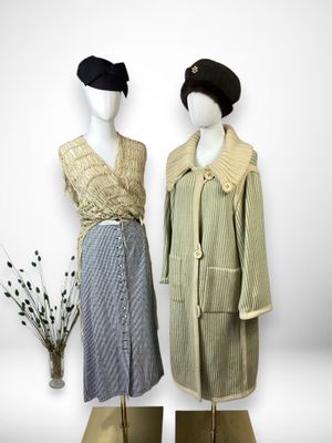 two mannequins dressed in different styles of clothing and hats