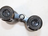 a close up of a pair of binoculars on a table