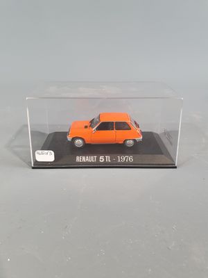 an orange toy car in a clear display case on a white surface
