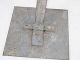 a square metal object with a cross on it