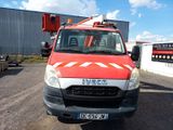 a red and white truck parked in a parking lot