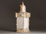 an image of a white and gold statue of a castle