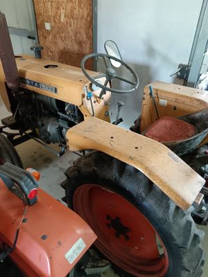 a tractor that is parked in a garage
