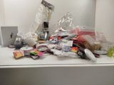 a white counter top with a bunch of items on it