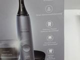the box of the electric toothbrush is open and ready to be used