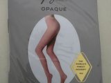 an image of a package of opaque tights with a woman ' s legs