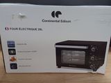 boxed box of a toaster oven sitting on a wooden table