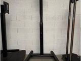 two black stands that are next to each other in a room