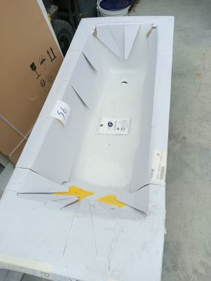 a white bath tub sitting on top of a table