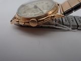 a watch that is sitting on top of a bracelet