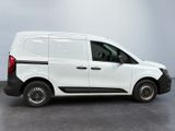 the white van is parked on the concrete floor in the room