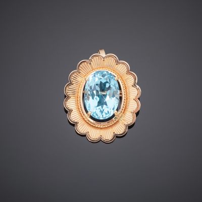 an aquamarinee and gold broochle