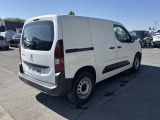 the white van is parked in a parking lot with other cars