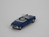 a toy car that is sitting on a white surface