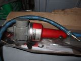 a box with a hose and a red and blue hose