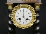 a clock that is sitting on top of a table