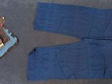 a pair of blue pants and a book on the floor