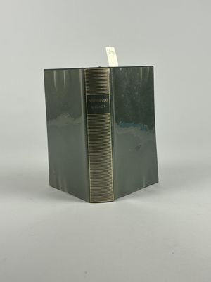 a book that is sitting on a white surface