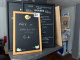 a chalk board with a menu on it next to a blackboard