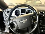 the interior of a car with a steering wheel and dashboard controls