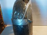 a large black object wrapped in plastic sitting on a table