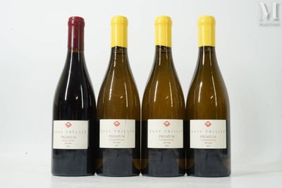 trois bouteilles de vin posées l'une à côté de l'autre sur une table
