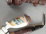 three different types of toothbrushes and a toothbrush holder