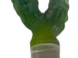 a green cactus plant in a clear container on a white background