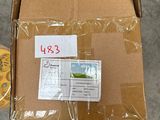 a cardboard box with a sticker on it sitting on the floor